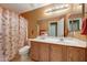 Bathroom featuring modern fixtures, a shower and a large mirror at 1384 S 222Nd Ln, Buckeye, AZ 85326