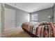 Neutral bedroom with a window provides natural light, with carpet flooring at 1384 S 222Nd Ln, Buckeye, AZ 85326
