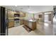 Functional kitchen featuring wooden cabinets, stainless steel appliances, and ample counter space, perfect for cooking at 1384 S 222Nd Ln, Buckeye, AZ 85326