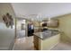 Functional kitchen featuring wooden cabinets, stainless steel appliances, and ample counter space, perfect for cooking at 1384 S 222Nd Ln, Buckeye, AZ 85326