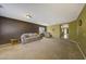 Spacious living room with neutral carpeting, large windows, and comfortable seating, creating a relaxing atmosphere at 1384 S 222Nd Ln, Buckeye, AZ 85326