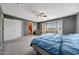 A spacious primary bedroom features a sitting area near the bay window at 1384 S 222Nd Ln, Buckeye, AZ 85326