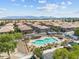 Overhead shot of community pool and amenities with surrounding residential homes and scenic mountain backdrop at 1441 N 80Th Ln, Phoenix, AZ 85043