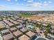 Community aerial view showcasing the pool, nearby amenities, and residential homes at 1441 N 80Th Ln, Phoenix, AZ 85043