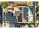 Aerial view of home with solar panels and backyard pool at 15046 W Post Dr, Surprise, AZ 85374
