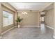 Bright dining area with decorative lighting, large window, and neutral wall color, perfect for entertaining at 15046 W Post Dr, Surprise, AZ 85374