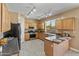 Functional kitchen with granite countertops, stainless steel appliances, and ample cabinet space for storage at 15046 W Post Dr, Surprise, AZ 85374