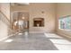 Bright living space with natural light, tile floors, and staircase view, ready for creating a cozy atmosphere at 15046 W Post Dr, Surprise, AZ 85374