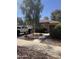 Attractive single story home featuring a tiled roof and desert landscaping at 15144 W Washington St, Goodyear, AZ 85338