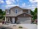 Charming two-story home with stone accents and a two-car garage at 15506 W Deanne Dr, Waddell, AZ 85355