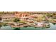 Beautiful community with lush landscaping, a pond, and inviting outdoor spaces for residents at 20119 N Laguna Way, Maricopa, AZ 85138