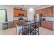 Well-appointed kitchen with granite countertops, stainless steel appliances, and an eat-in island at 20119 N Laguna Way, Maricopa, AZ 85138