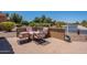 Cozy patio area with outdoor seating, offering a relaxing space with charming views at 20119 N Laguna Way, Maricopa, AZ 85138