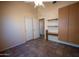 Bedroom featuring a ceiling fan, built-in storage, shelving and tiled floor at 20443 N 39Th Dr, Glendale, AZ 85308