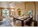 Bright and airy dining room featuring a table set for six, tile flooring, and a large window at 20443 N 39Th Dr, Glendale, AZ 85308