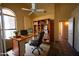 Home office with a built-in bookshelf, desk, office chair, and carpeted floor at 20443 N 39Th Dr, Glendale, AZ 85308
