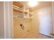 The laundry room offers built-in shelves, tiled flooring, and a door leading to the outside at 20443 N 39Th Dr, Glendale, AZ 85308