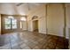 Spacious open-plan living area with neutral walls and tile floors providing a blank canvas at 20443 N 39Th Dr, Glendale, AZ 85308
