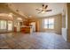 Open concept living space with tile floors and abundant natural light, leading to a kitchen at 20443 N 39Th Dr, Glendale, AZ 85308