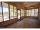 Relaxing sunroom with large windows and tiled flooring, perfect for enjoying natural light at 20443 N 39Th Dr, Glendale, AZ 85308