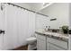 Bathroom features granite vanity, and a shower with a new white shower curtain at 2137 E New Bedford Dr, Gilbert, AZ 85234