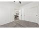 Spacious bedroom featuring carpet flooring, a ceiling fan and an ensuite bathroom with and closets at 2137 E New Bedford Dr, Gilbert, AZ 85234