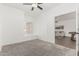 Bright bedroom featuring a ceiling fan and a window with a cozy window seat perfect for reading or relaxation at 2137 E New Bedford Dr, Gilbert, AZ 85234