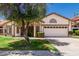 Charming single-story home with a well-maintained lawn and a two-car garage at 2137 E New Bedford Dr, Gilbert, AZ 85234
