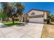 Single-story home with a well-maintained lawn and a two-car garage at 2137 E New Bedford Dr, Gilbert, AZ 85234