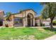 Inviting home with a well-manicured lawn and mature trees at 2137 E New Bedford Dr, Gilbert, AZ 85234