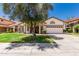 Charming single-story home with a well-maintained lawn and a two-car garage at 2137 E New Bedford Dr, Gilbert, AZ 85234