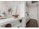 Interior view showcasing a decorative display shelf, wooden sailboat and adjacent kitchen at 2137 E New Bedford Dr, Gilbert, AZ 85234