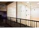 Upper level view of racquetball or squash court with glass walls and wooden floor at 2137 E New Bedford Dr, Gilbert, AZ 85234