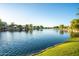 Beautiful waterfront homes with lush green lawns line the serene canal at 2137 E New Bedford Dr, Gilbert, AZ 85234