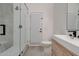 Bathroom with glass-enclosed shower and natural wood vanity at 2203 E Crest Ln, Phoenix, AZ 85024
