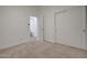 Bedroom featuring carpet, closet with sliding doors, and an ensuite bathroom at 2203 E Crest Ln, Phoenix, AZ 85024