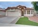 Charming single-story home featuring a red tile roof and a well-manicured lawn at 2203 E Crest Ln, Phoenix, AZ 85024
