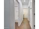 Bright hallway featuring wood-look tile floors and access to the bathroom with a tub-shower combo at 2203 E Crest Ln, Phoenix, AZ 85024