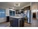 Modern kitchen with stainless steel appliances, a center island, and stylish cabinetry at 2203 E Crest Ln, Phoenix, AZ 85024