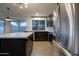Well-lit kitchen with a center island, modern appliances, and sleek cabinetry at 2203 E Crest Ln, Phoenix, AZ 85024