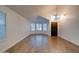 Open living room showcasing wood-look tile flooring, high ceilings, and lots of natural light at 2203 E Crest Ln, Phoenix, AZ 85024