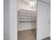 Walk-in closet with custom shelving and lighting at 2203 E Crest Ln, Phoenix, AZ 85024