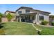 Spacious backyard with lush lawn, stepping stones, and covered patio seating area at 3123 E Buena Vista Dr, Chandler, AZ 85249