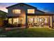 This backyard has grass, a covered patio, and an outdoor kitchen at 3123 E Buena Vista Dr, Chandler, AZ 85249