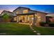 This backyard has grass, a covered patio, and an outdoor kitchen at 3123 E Buena Vista Dr, Chandler, AZ 85249