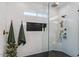 Modern bathroom featuring a tiled shower with a glass door and bronze fixtures at 3123 E Buena Vista Dr, Chandler, AZ 85249