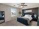 Stylish bedroom with a dark blue tufted bed, textured accent wall, and matching nightstands at 3123 E Buena Vista Dr, Chandler, AZ 85249