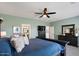 Comfortable bedroom featuring a ceiling fan, nice decor, and light green walls at 3123 E Buena Vista Dr, Chandler, AZ 85249