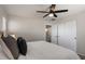 This secondary bedroom has a ceiling fan, closet, and natural light at 3123 E Buena Vista Dr, Chandler, AZ 85249