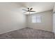 Neutral-toned bedroom with plush carpet, window, and ceiling fan offering a calm and inviting space at 3123 E Buena Vista Dr, Chandler, AZ 85249
